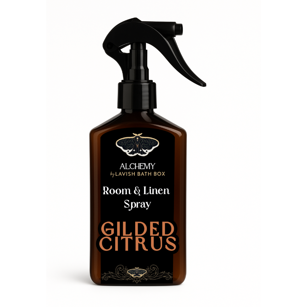 Brown room and linen spray bottle labeled 'Gilded Citrus' by Alchemy on a white background