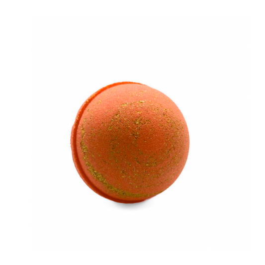 Orange bath bomb with gold glitter on a white background